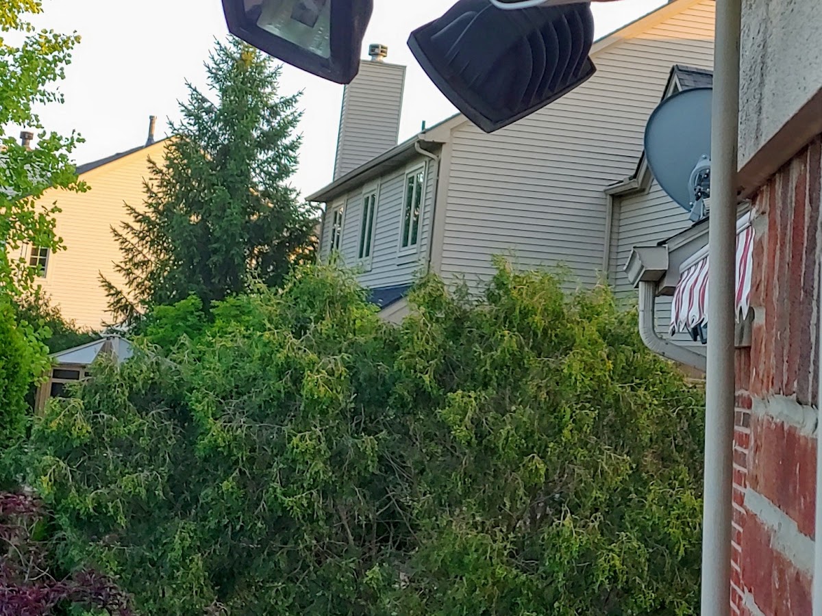 CCTV bullet cameras installed on exterior wall bracket at a Metro Detroit home