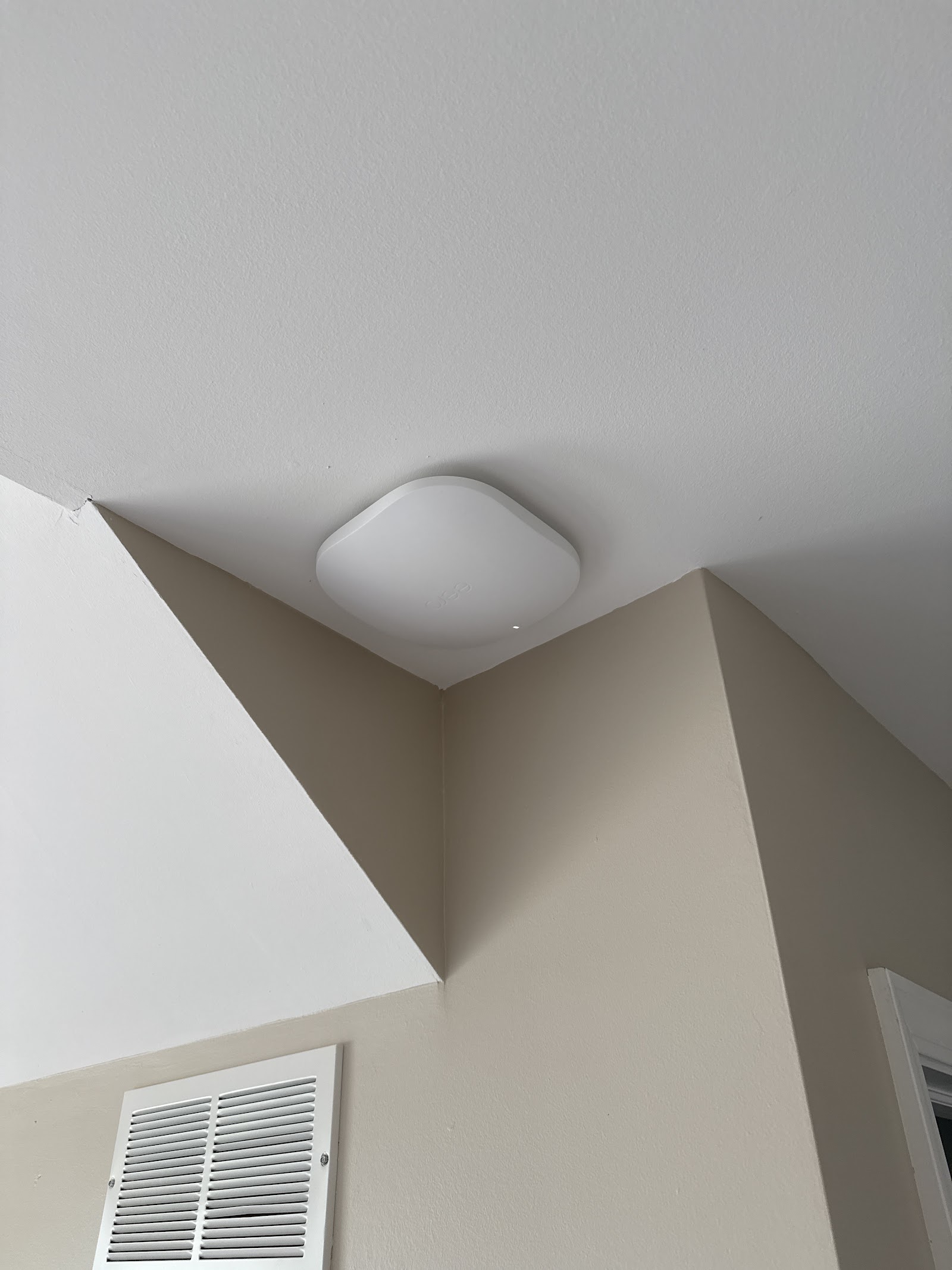Ceiling-mounted WiFi access point installed for whole-home coverage by Rtechwork